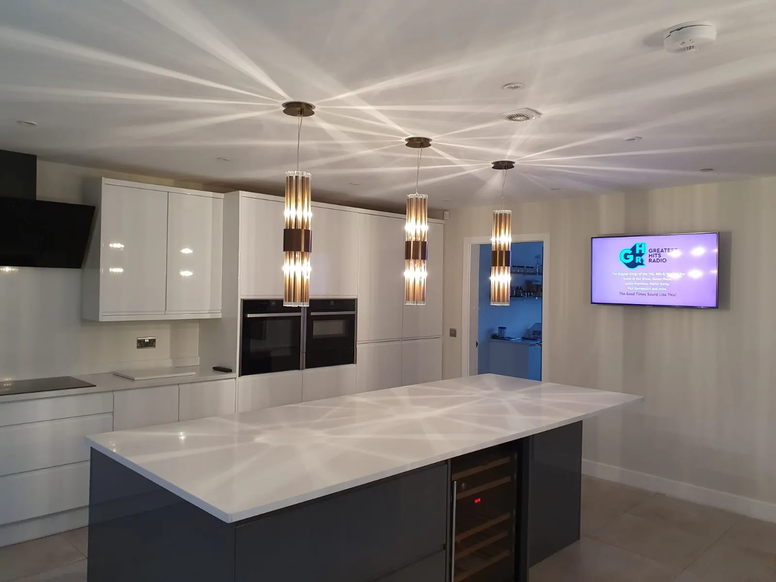 a kitchen with a large white counter top